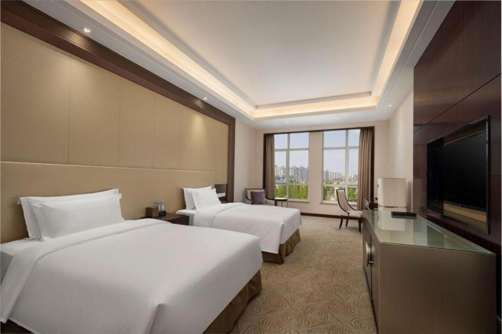 Linyi Blue Horizon International Hotel Yi He Экстерьер фото